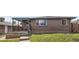 Brick house with covered front porch and healthy green grass at 925 Wolff St, Denver, CO 80204