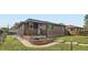 Charming brick home with a covered front porch and well-maintained landscaping at 925 Wolff St, Denver, CO 80204