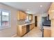 Well-lit kitchen with stainless steel appliances and stone backsplash at 925 Wolff St, Denver, CO 80204