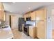 Functional kitchen with stainless appliances, tile floors, and ample cabinetry at 925 Wolff St, Denver, CO 80204