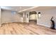 Spacious open area with wood-style flooring and arched doorways at 925 Wolff St, Denver, CO 80204