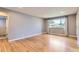 Bright, open living room showcasing gleaming hardwood floors and large windows at 925 Wolff St, Denver, CO 80204