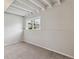 Basement with exposed ceiling beams and natural light at 19053 E 22Nd Dr, Aurora, CO 80011