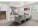 Cozy finished basement with carpeting, a seating area, and entertainment center at 19053 E 22Nd Dr, Aurora, CO 80011