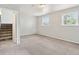Spacious unfinished basement with stairs, and two large windows at 19053 E 22Nd Dr, Aurora, CO 80011