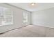Spacious carpeted bedroom features two windows letting in natural light at 19053 E 22Nd Dr, Aurora, CO 80011