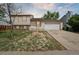 Inviting two-story home featuring a manicured front yard and attached two-car garage at 19053 E 22Nd Dr, Aurora, CO 80011