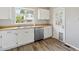 Bright kitchen with stainless steel dishwasher and laminate countertops at 19053 E 22Nd Dr, Aurora, CO 80011