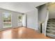 Bright living room boasts hardwood floors and a staircase at 19053 E 22Nd Dr, Aurora, CO 80011