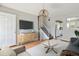 Cozy living room with hardwood floors, staircase, and neutral décor at 19053 E 22Nd Dr, Aurora, CO 80011