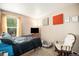 Comfortable bedroom with a large window and natural light at 814 Pintail Ave, Brighton, CO 80601