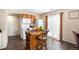 Bright kitchen features an island, white appliances, and access to outdoor area at 814 Pintail Ave, Brighton, CO 80601