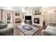 Comfortable living room featuring a fireplace, hardwood floors, and neutral walls at 814 Pintail Ave, Brighton, CO 80601