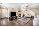 Comfortable living room featuring a fireplace, hardwood floors, and neutral walls at 814 Pintail Ave, Brighton, CO 80601