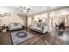 Inviting living room featuring neutral walls, hardwood floors, and comfortable sofas at 814 Pintail Ave, Brighton, CO 80601