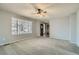 Bright and airy living room featuring neutral walls and carpeted floors at 11366 Birch Ct, Thornton, CO 80233