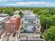 A high-angle shot of a multi-story condo building offering rooftop decks, patios, and balconies, plus parking at 340 S Lafayette St # 204, Denver, CO 80209