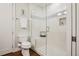 Clean bathroom featuring a glass enclosed shower with white tile and a built-in bench at 340 S Lafayette St # 204, Denver, CO 80209