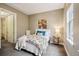 Cozy bedroom with a plush bed, accent pillows, and a view from the window at 340 S Lafayette St # 204, Denver, CO 80209