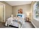 Cozy bedroom with a plush bed, accent pillows, and a view from the window at 340 S Lafayette St # 204, Denver, CO 80209