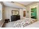 Comfortable bedroom with a large dresser, mirror, and connecting room at 340 S Lafayette St # 204, Denver, CO 80209