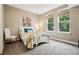 Comfortable bedroom with two large windows, neutral paint, and a plush carpet at 340 S Lafayette St # 204, Denver, CO 80209