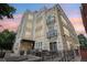 Beautiful modern building exterior with black metal balconies and gorgeous sunset sky at 340 S Lafayette St # 204, Denver, CO 80209