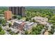 Multi-story residential building surrounded by trees, offering views of a tennis court and a serene neighborhood setting at 340 S Lafayette St # 204, Denver, CO 80209