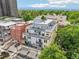 Multi-story residential building featuring balconies and a rooftop terrace offering stunning mountain views in a desirable neighborhood at 340 S Lafayette St # 204, Denver, CO 80209