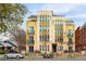 A well-maintained multi-story building featuring balconies and modern architecture, set on a tree-lined street in a neighborhood at 340 S Lafayette St # 204, Denver, CO 80209