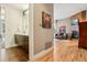 Interior view of bathroom with vanity and living room with fireplace at 340 S Lafayette St # 204, Denver, CO 80209