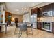 Open kitchen and dining area with stainless steel appliances and modern chandelier lighting at 340 S Lafayette St # 204, Denver, CO 80209