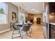 Open concept kitchen featuring a dining table with chandelier and stainless steel appliances at 340 S Lafayette St # 204, Denver, CO 80209