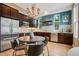 Modern kitchen with stainless steel appliances, dark cabinets, and a decorative tile backsplash at 340 S Lafayette St # 204, Denver, CO 80209