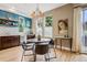 Eat-in kitchen featuring dark cabinets, blue walls and large windows for natural light at 340 S Lafayette St # 204, Denver, CO 80209