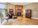 Cozy living room features a fireplace, hardwood floors, and large windows offering natural light at 340 S Lafayette St # 204, Denver, CO 80209