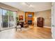 Bright living room with a fireplace, hardwood floors, and a sliding glass door to a balcony at 340 S Lafayette St # 204, Denver, CO 80209