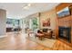 Spacious living room featuring hardwood floors, gas fireplace and modern furniture at 340 S Lafayette St # 204, Denver, CO 80209