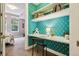 Home office nook features a built in desk, open shelving, and unique wallpaper at 340 S Lafayette St # 204, Denver, CO 80209