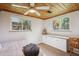 Bright bedroom featuring hardwood ceilings, neutral walls, and natural light from dual windows at 2330 Yarrow St, Lakewood, CO 80214