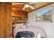 Bedroom featuring wood ceiling and built in shelves, with a window providing natural light at 2330 Yarrow St, Lakewood, CO 80214