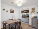 Classic dining area with hardwood table and view of living area, perfect for entertaining guests at 2330 Yarrow St, Lakewood, CO 80214