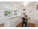 Charming dining area features a marble countertop, built-in shelving, and a cozy table for intimate meals at 2330 Yarrow St, Lakewood, CO 80214