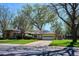 Lovely single-Gathering home with a garage, green lawn, and mature trees in a serene neighborhood setting at 2330 Yarrow St, Lakewood, CO 80214