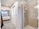 Hallway featuring a tiled shower with glass door, adding a touch of elegance and convenience at 1432 Red Mica Way, Monument, CO 80132