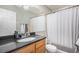 Bright bathroom with a double vanity, bathtub-shower combo, and modern fixtures for convenience at 1432 Red Mica Way, Monument, CO 80132