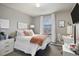Cozy bedroom with a plush bed, window, and dedicated workspace, providing comfort and functionality at 1432 Red Mica Way, Monument, CO 80132