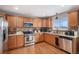 Well-equipped kitchen with stainless steel appliances, granite countertops, and ample cabinet space at 1432 Red Mica Way, Monument, CO 80132