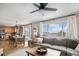 Open concept living room with access to a dining area and modern furniture at 1432 Red Mica Way, Monument, CO 80132