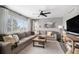 Bright living room with a large window, a comfy sectional sofa, and stylish decorations at 1432 Red Mica Way, Monument, CO 80132